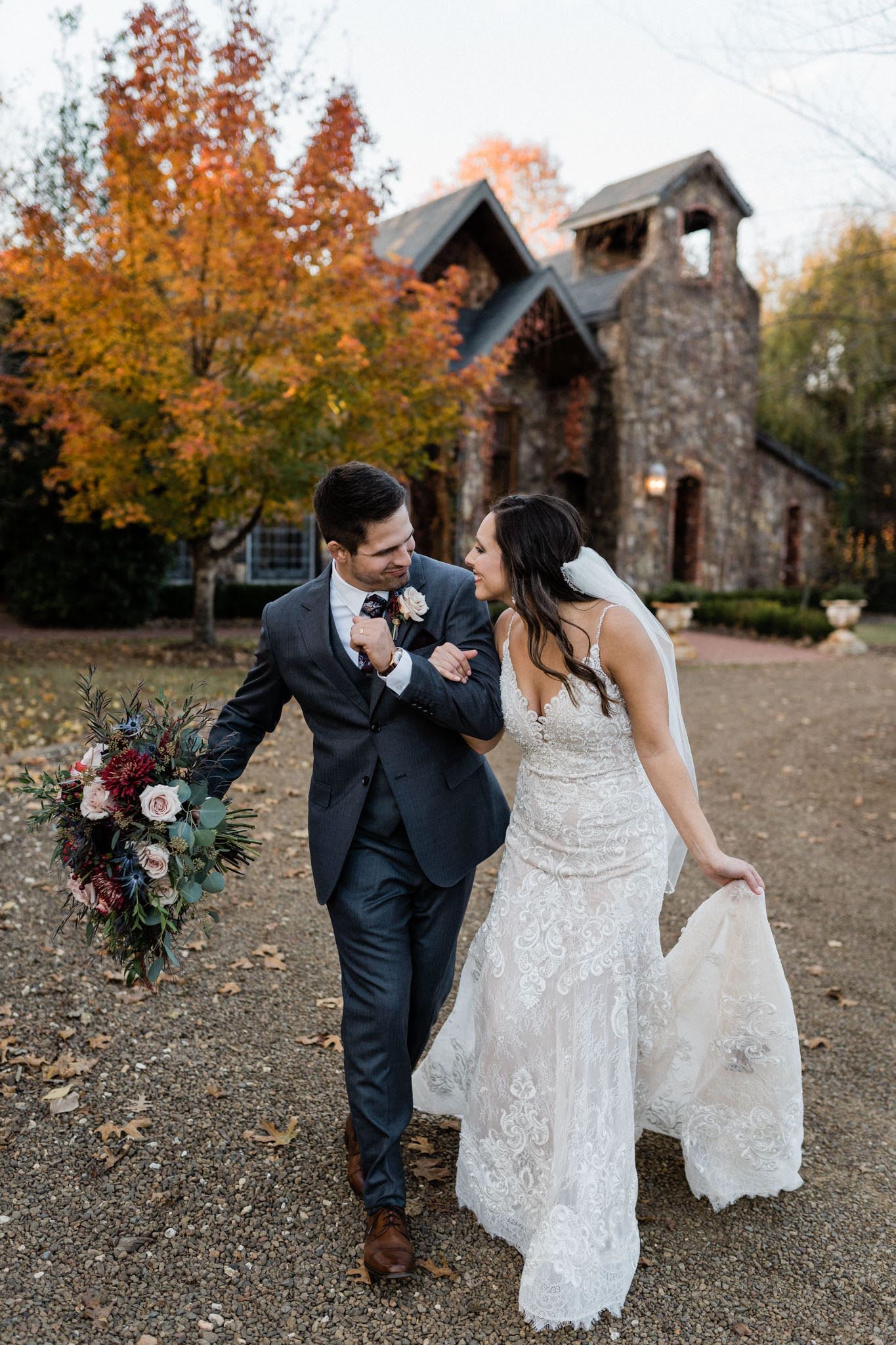bride and groom in fall
