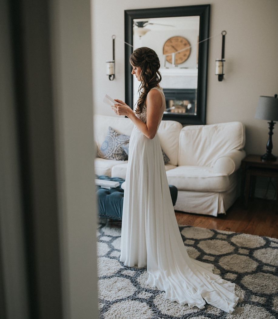 bride reading a note alone in a room