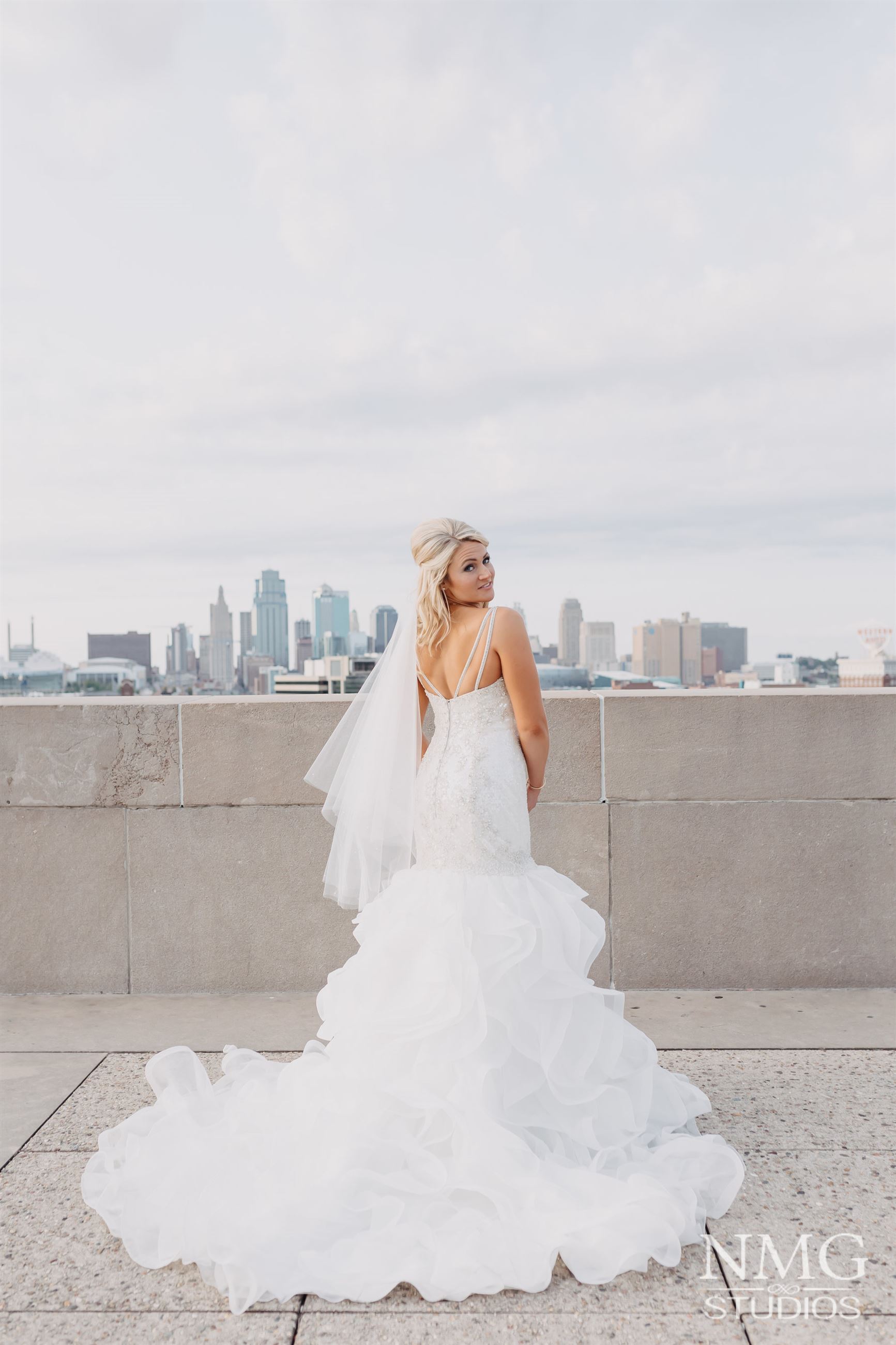 bride wearing a large dress looking behind her shoulder