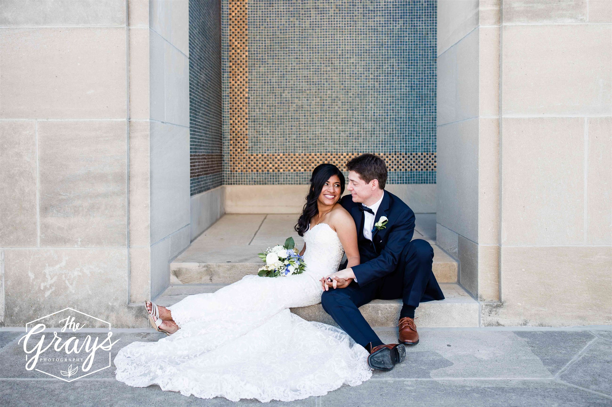 Bride and Groom Sitting On Steps